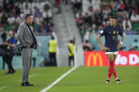 Poland's head coach Czeslaw Michniewicz looks across ar France's Kylian Mbappe during the World Cup round of 16 soccer match between France and Poland, at the Al Thumama Stadium in Doha, Qatar, Sunday, Dec. 4, 2022. (AP Photo/Natacha Pisarenko)