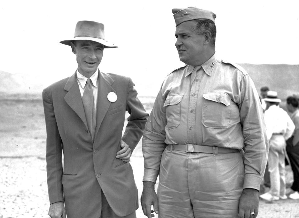 Gen. John Leslie R. Groves, right, appears with Dr. J. Robert Oppenheimer, inspect the base of a tower at the site of an atomic bomb test was exploded in Alamogordo, N.M., on Sept. 9, 1945.