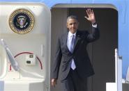 U.S. President Barack Obama waves as he arrives to take part in the G20 Summit in St. Petersburg, September 5, 2013. REUTERS/Alexander Demianchuk