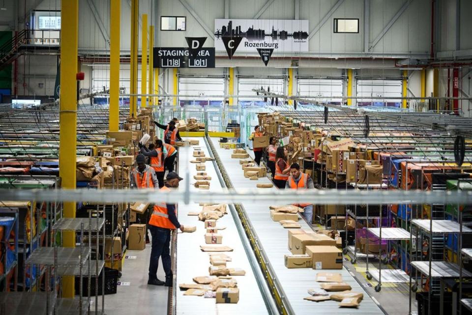 Employees work at an Amazon delivery station in Rozenburg, Netherlands (ANP/AFP via Getty Images)