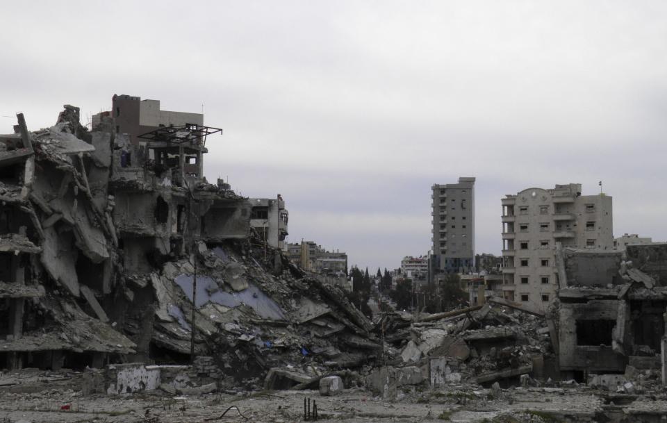 A general view of damaged buildings are seen in the besieged area of Homs February 2, 2014. Picture taken February 2, 2014. REUTERS/Thaer Al Khalidiya (SYRIA - Tags: POLITICS CIVIL UNREST CONFLICT)