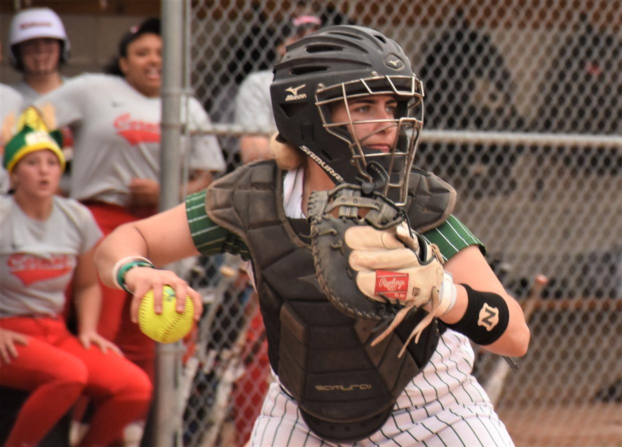 Mohawk Valley Community College catcher Joely Welpe comes up throwing Sunday during the second game of a doubleheader against Corning Community College. Mohawk Valley and Corning meet again this weekend in the NJCAA's Region III-B semifinal playoff series.