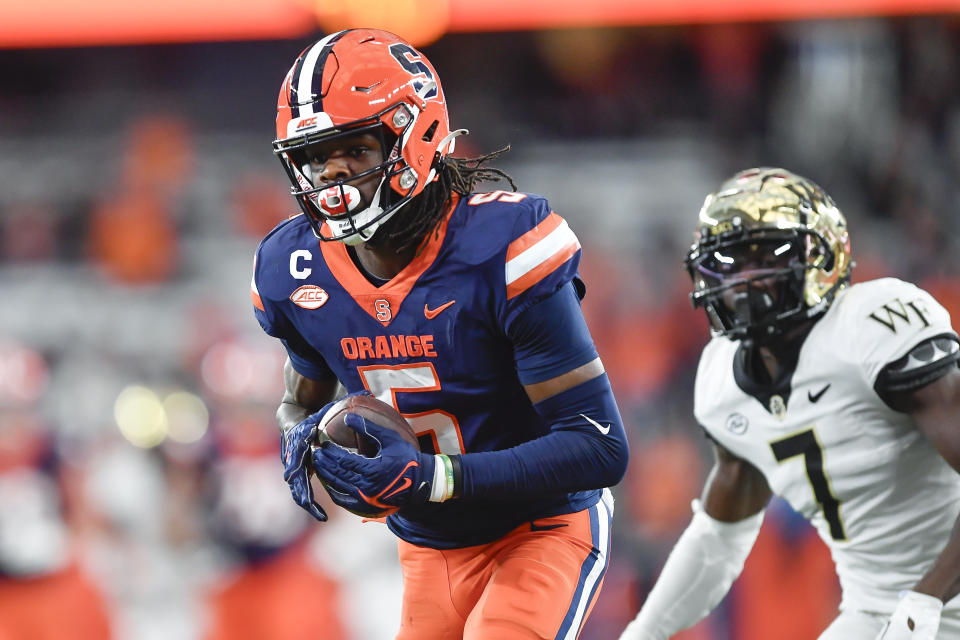 Syracuse wide receiver Damien Alford (5) catches a touchdown pass during the second half of an NCAA college football game against Wake Forest in Syracuse, N.Y., Saturday, Nov. 25, 2023. (AP Photo/Adrian Kraus)