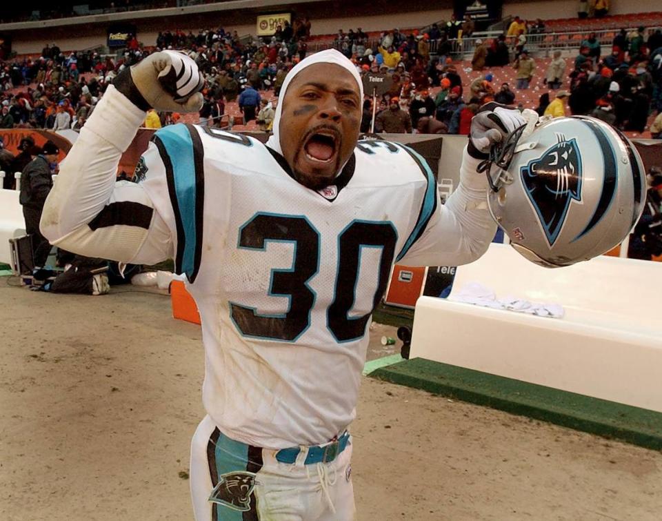 Carolina Panthers safety Mike Minter celebrates his team’s victory over the Cleveland Browns as he runs off the field in 2002.