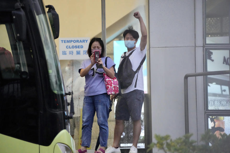 A staff member shows a sign of thanks for their supporters at the Apple Daily headquarters in Hong Kong, Wednesday, June 23, 2021. Hong Kong's pro-democracy Apple Daily newspaper will stop publishing Thursday, following last week's arrest of five editors and executives and the freezing of $2.3 million in assets under the city's one-year-old national security law. (AP Photo/Kin Cheung)