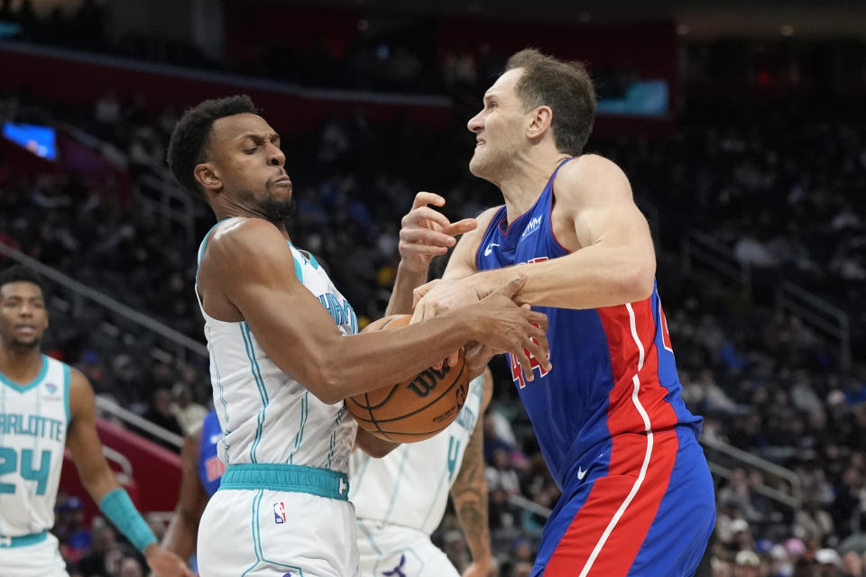 Charlotte Hornets guard Ish Smith steals the ball away from Detroit Pistons forward Bojan Bogdanovic (44) during the second half of an NBA basketball game, Wednesday, Jan. 24, 2024, in Detroit. (AP Photo/Carlos Osorio)