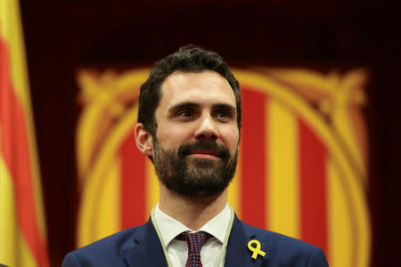 Roger Torrent, new Speaker of Catalan parliament, poses at the end of the first session of Catalan Parliament after the regional elections in Barcelona, Spain, January 17, 2018. REUTERS/Albert Gea