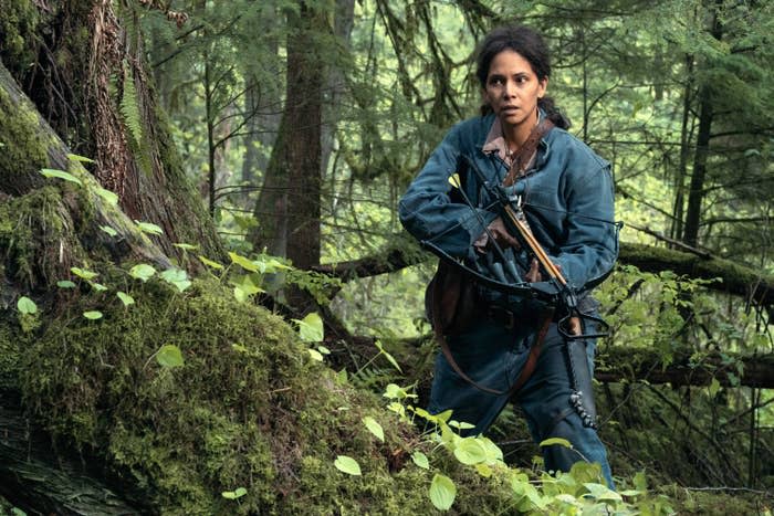 Halle Berry in a forest, holding a crossbow in "Never Let Go"