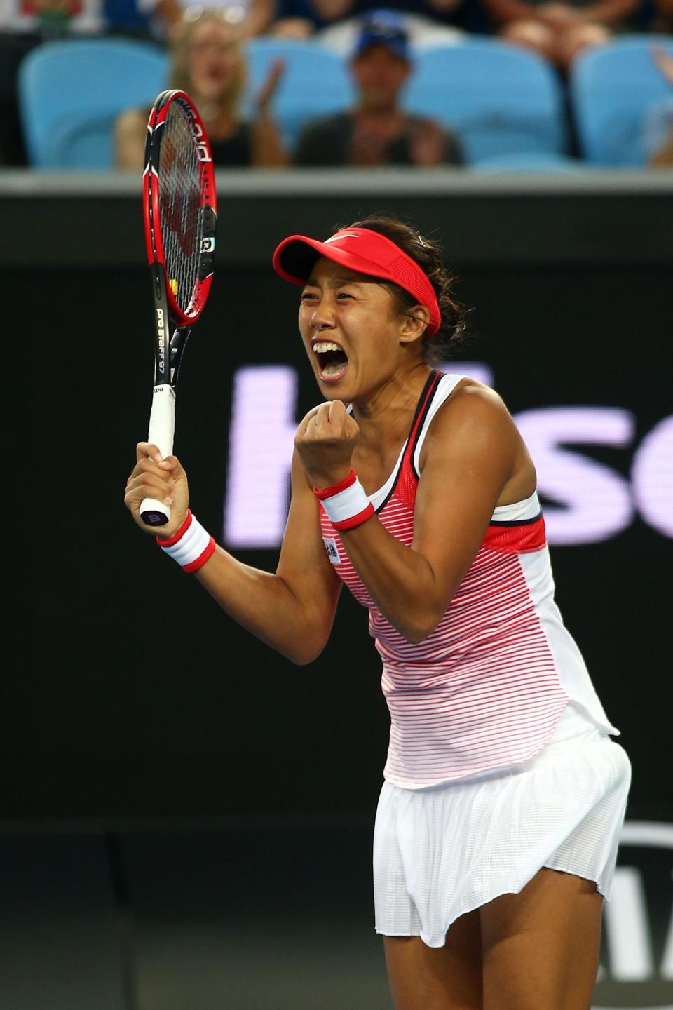 MELBOURNE, AUSTRALIA - JANUARY 19:  Shuai Zhang of China celebrates winning her first round match against Simona Halep of Romania during day two of the 2016 Australian Open at Melbourne Park on January 19, 2016 in Melbourne, Australia.  (Photo by Mark Kolbe/Getty Images)