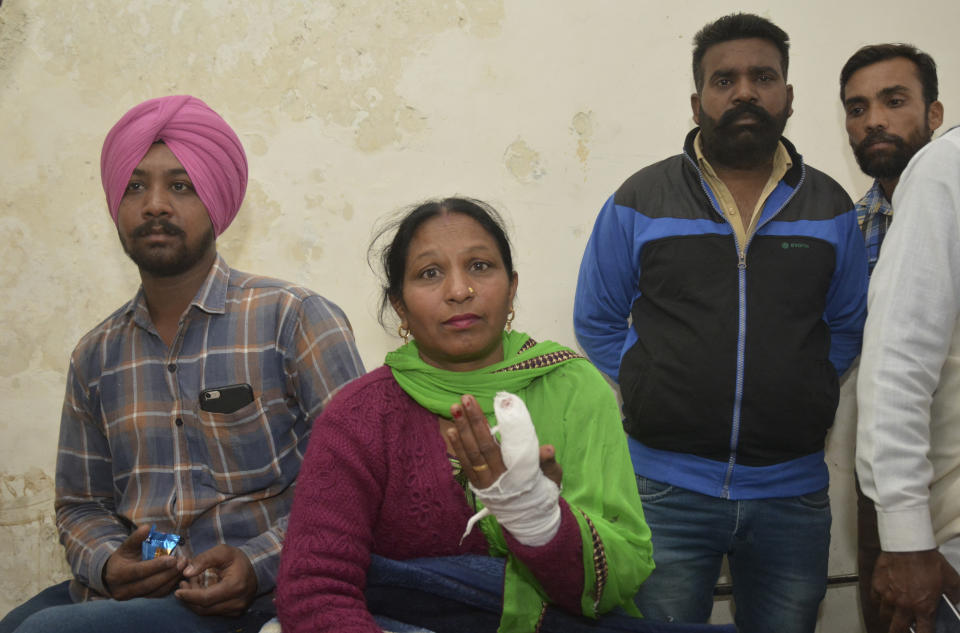 A woman injured in a blast at Nirankari Bhawan, a prayer hall in nearby Adliwal village receives treatment at a hospital in Amritsar, India, Sunday, Nov.18, 2018. Three people were killed and over a dozen injured on Sunday when two men on a motorbike targeted the prayer hall with a grenade police said. (AP Photo/Prabhjot Gill)