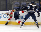 Florida Panthers defenseman Radko Gudas, left, of the Czech Republic, collides with Columbus Blue Jackets defenseman Seth Jones during the second period of an NHL hockey game in Columbus, Ohio, Tuesday, Jan. 26, 2021. (AP Photo/Paul Vernon)