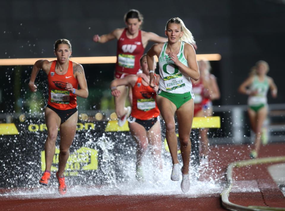 Oregon's Aneta Konieczek, right, leads the women 3,000-meter steeplechase at the Oregon Relays at Hayward Field Friday April 22, 2022.