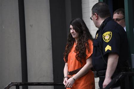 Miranda Barbour, 19, the woman dubbed the so-called Craigslist killer suspect, exits court with sheriff deputies in Sunbury, Pennsylvania April 1, 2014. REUTERS/Mark Makela