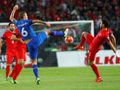 Iceland's Ragnar Sigurdsson (L) fights for the ball with Turkey's Hakan Calhanoglu during their Euro 2016 Group A qualification soccer match in Konya, Turkey, October 13, 2015. REUTERS/Umit Bektas