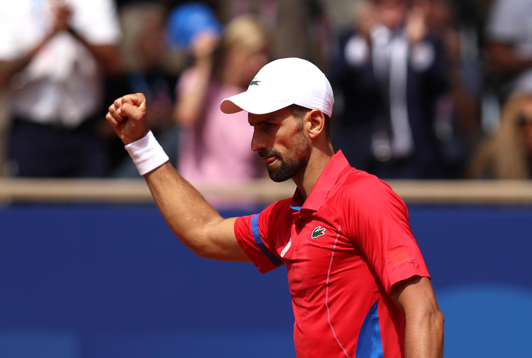 PARIS, FRANCE - AUGUST 04: Novak Djokovic of Team Serbia celebrates winning the first set tie breaker during the Men's Singles Gold medal match against Carlos Alcaraz of Team Spain on day nine of the Olympic Games Paris 2024 at Roland Garros on August 04, 2024 in Paris, France. (Photo by Clive Brunskill/Getty Images)