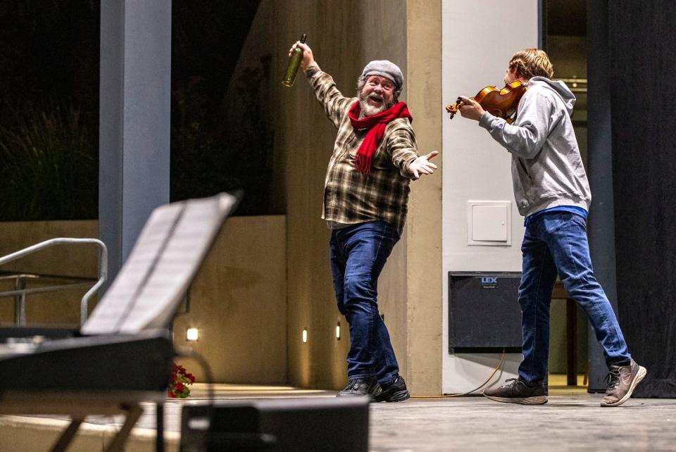 Jason Wesley Green performing as Tevye dances with the fiddler during a rehearsal for "Fiddler On The Roof" at the Rancho Mirage Amphitheater in Rancho Mirage, Calif., Tuesday, Feb. 27, 2024.