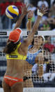 US Kerri Walsh (R) spikes against Brazilian Juliana Felisberta Silva during their FIVB Beach Volleyball World Championships final in Rome's Foro Italico on June 19, 2011. Brazil won the final. AFP PHOTO/ FILIPPO MONTEFORTE (Photo credit should read FILIPPO MONTEFORTE/AFP/Getty Images)