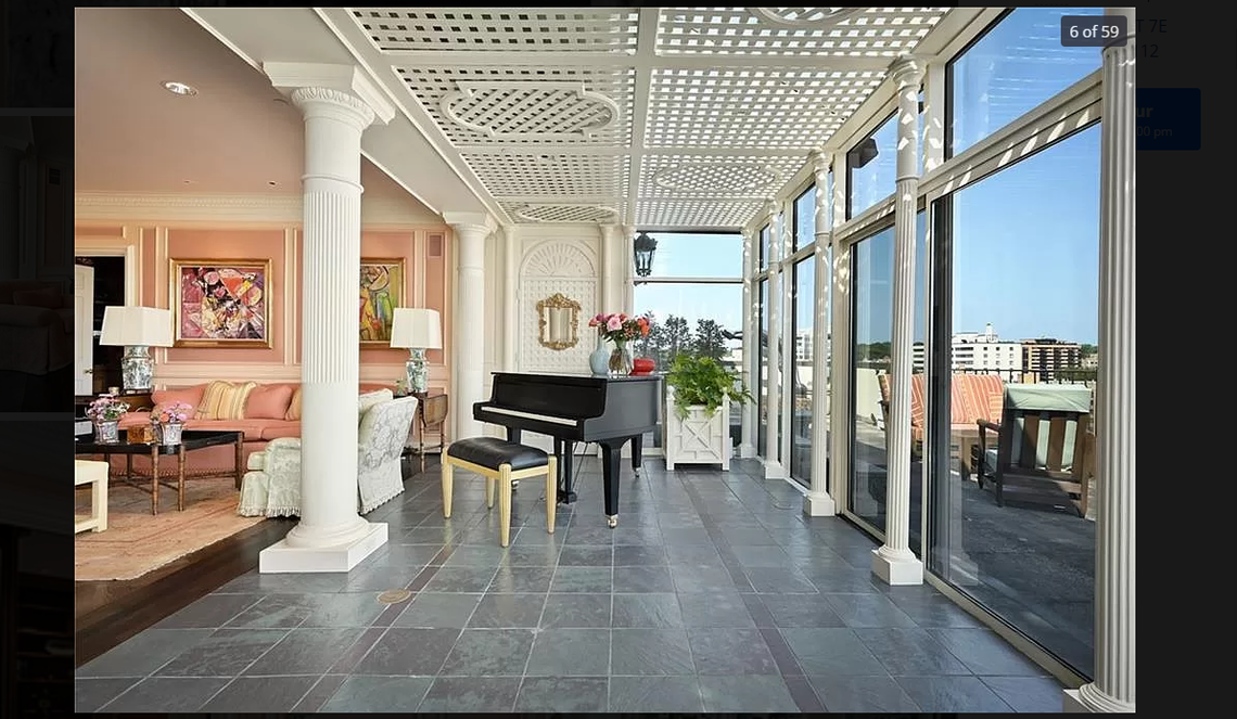 The living room of 433 Ward Parkway, Unit 7E. This Kansas City penthouse overlooking the Plaza is listed for $4.4 million. Screenshot from Zillow. March 7, 2024.