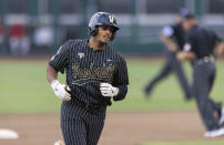 Vanderbilt's Jayson Gonzalez rounds the bases after hitting a two-run home run against Arizona in the fifth inning during a baseball game in the College World Series, Saturday, June 19, 2021, at TD Ameritrade Park in Omaha, Neb. (AP Photo/Rebecca S. Gratz)