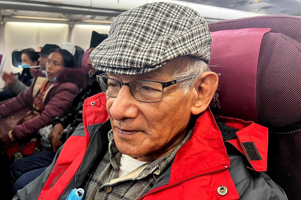 French serial killer Charles Sobhraj sits in an aircraft departing from Kathmandu to France (AFP via Getty Images)