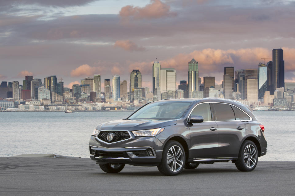 This undated photo provided by Honda shows the 2020 Acura MDX Sport Hybrid, a midsize SUV with an EPA-estimated 27 mpg in mixed driving. (American Honda Motor Co. via AP)