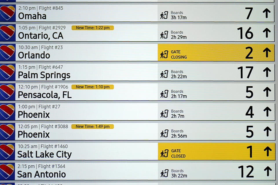 A kiosk notifies travelers to the status of departing flights at Love Field airport, Friday, May 19, 2023, in Dallas. The unofficial start of the summer travel season is here, with airlines hoping to avoid the chaos of last year and travelers scrounging for ways to save a few bucks on pricey airfares and hotel rooms.(AP Photo/Tony Gutierrez)