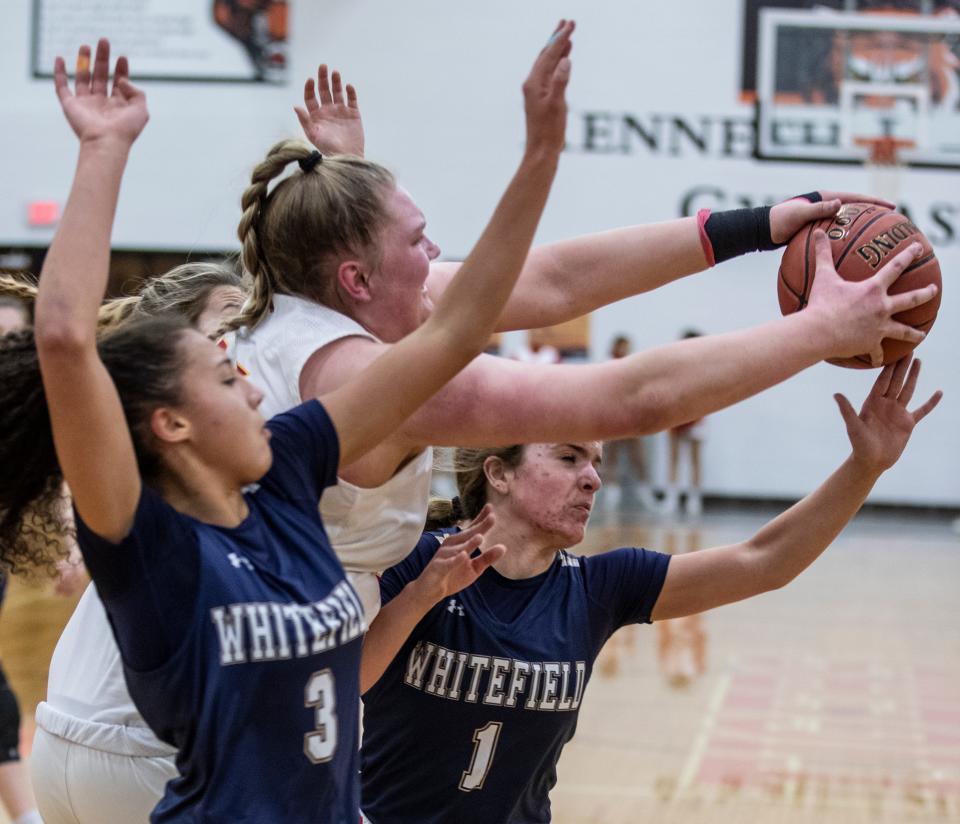 Bulllitt East's Grace Merkle losses the ball under tight defense by Whitefield Academy's Noel Smith, left, and Camryn Poole during 24th District Girls tournament action. Feb. 21, 2022