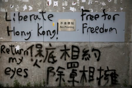 The wall of a building of the Central Government Offices is prayed with slogans in Hong Kong