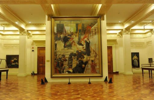 A restored painting of Felix Resureccion Hidalgo at the National Museum in Manila. Flash camera-toting tourists could wreck the Philippines' greatest works of art, says the worried curator of the National Museum, conservation laboratory chief Orlando Abinion