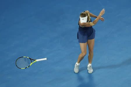 Tennis - Australian Open - Rod Laver Arena, Melbourne, Australia, January 19, 2018. Denmark's Caroline Wozniacki reacts and throws her racket during her match against Netherlands' Kiki Bertens. REUTERS/Edgar Su