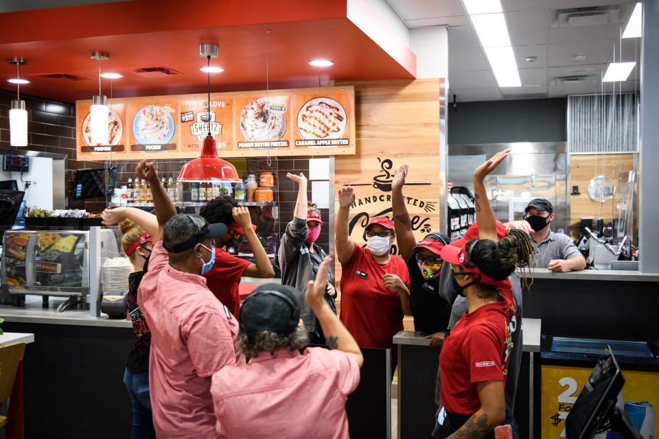 Sheetz employees do a cheer minutes before a store opening in September 2020.