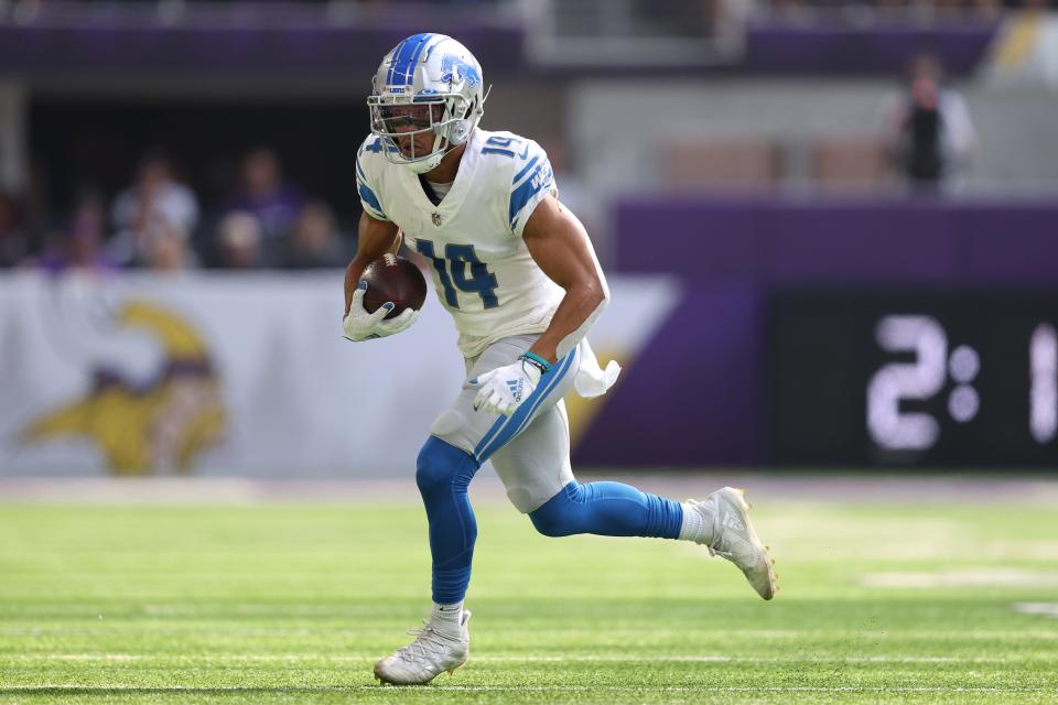 Lions wide receiver Amon-Ra St. Brown catches the ball for a first down during the first quarter against the Vikings on Sunday, Oct. 10, 2021, in Minneapolis.