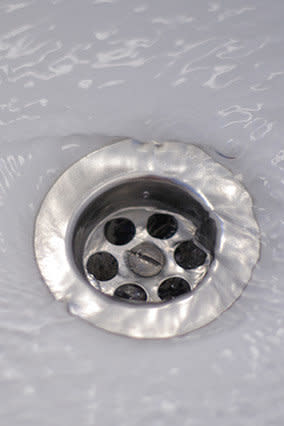 Environmentalist <a href="http://www.oprah.com/world/Why-Be-Green-By-Elizabeth-Rogers" target="_blank">Elizabeth Rogers</a> has a cheap, nontoxic solution to clogged drains: She pours a cup of baking soda down the drain, chases it with a cup of white vinegar and lets the two work their magic for five minutes. The finale: She flushes the drain clear with eight cups of near-boiling water.