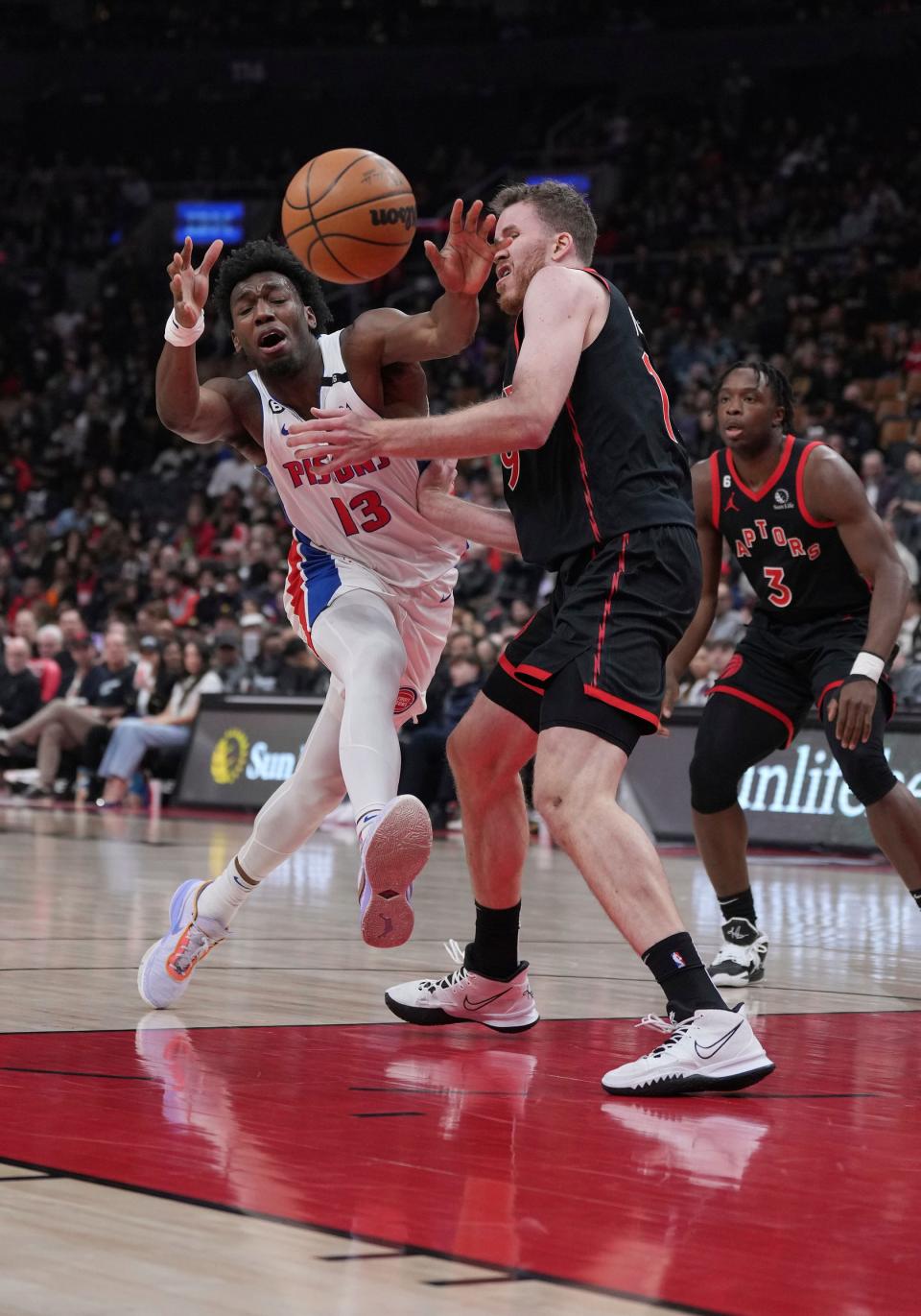 Pistons center James Wiseman battles for the ball with Raptors center Jakob Poeltl during the first quarter on Friday, March 24, 2023, in Toronto.