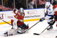 Florida Panthers goaltender Spencer Knight (30) stops a shot on the goal by Tampa Bay Lightning left wing Alex Killorn (17) during the first period in Game 5 of an NHL hockey Stanley Cup first-round playoff series, Monday, May 24, 2021, in Sunrise, Fla. (AP Photo/Lynne Sladky)