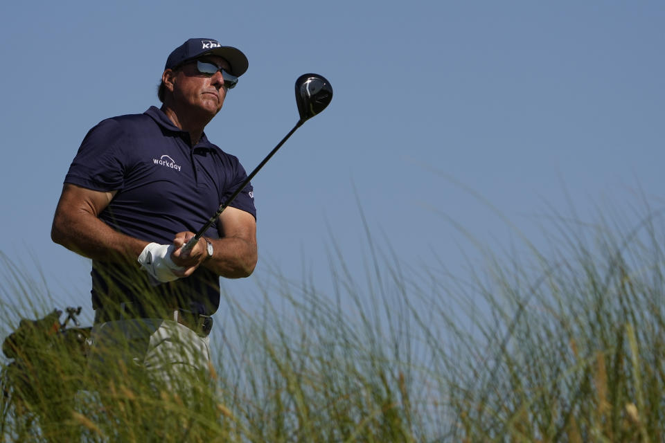Phil Mickelson watches his ball from the eighth tee during the final round at the PGA Championship golf tournament on the Ocean Course, Sunday, May 23, 2021, in Kiawah Island, S.C. (AP Photo/David J. Phillip)