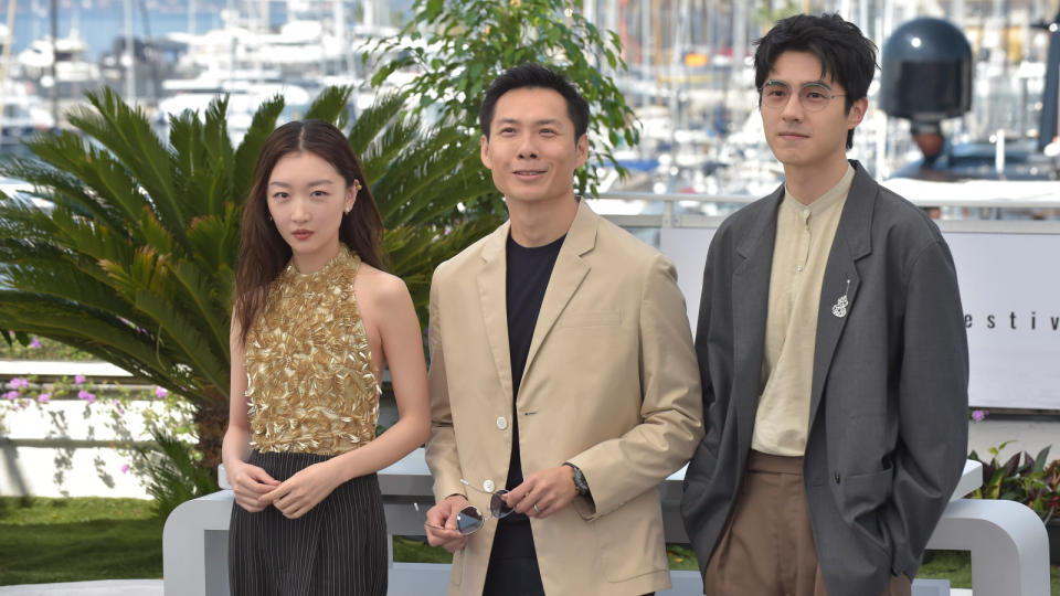 Anthony Chen (middle) with The Breaking Ice cast members Zhou Dongyu (left) and Liu Haoran (right) at the 2023 Cannes Film Festival. (Photo: Getty Images)