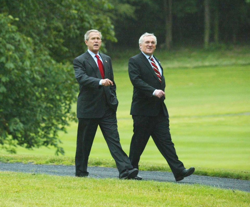 President George W. Bush with Irish Prime Minister Bertie Ahern, right, as they take a stroll at Dromoland Castle in Co. Clare, western Ireland, Friday June 25, 2004, at the start of the European Union / US summit meeting.