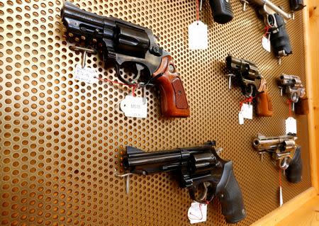 Handguns are displayed at Wyss Waffen gun shop in the town of Burgdorf, Switzerland August 10, 2016. REUTERS/Arnd Wiegmann