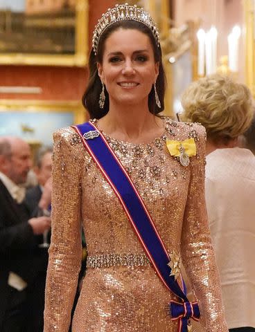 <p>BACKGRID</p> Kate Middleton attends a Buckingham Palace reception on Dec. 5, 2023