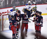 Winnipeg Jets' Josh Morrissey (44) celebrates after his goal against the St. Louis Blues with Saku Maenalanen (8), Neal Poink (4), Pierre-Luc Dubois (80) and Morgan Barron (36) during third-period NHL hockey game action in Winnipeg, Manitoba, Monday, Jan. 30, 2023. (Fred Greenslade/The Canadian Press via AP)