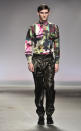 <b>Model, James Long<br></b><br>A model at the James Long AW13 show donned a printed shirt and baggy leather-look trousers.