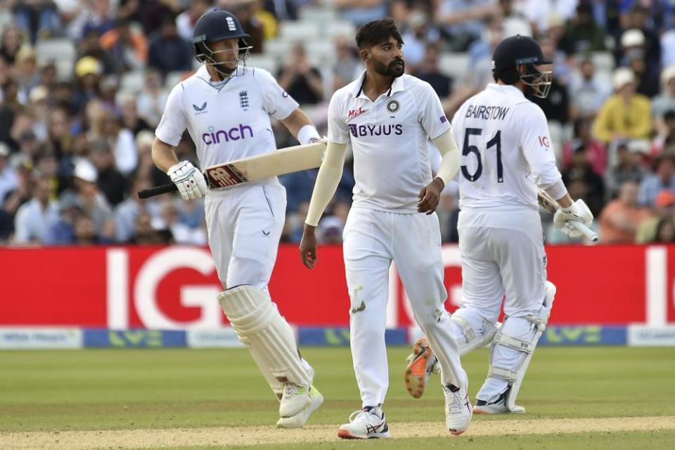 Mohammad Siraj looks on as Joe Root (left) and Jonny Bairstow push the chase on.