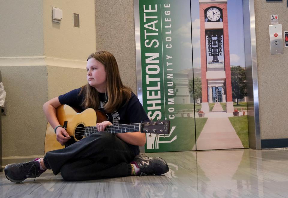 Feb 24, 2024; Tuscaloosa, Alabama, USA; Fiddle Fest 2024 features guitarists and fiddlers competed for the 2024 Southeast Fiddle Championship at Shelton State Saturday. Twelve-year-old Callie Doerfel from Murfreesboro, TN, waits for her turn on stage.