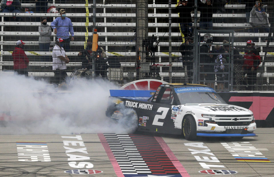 NASCAR Texas Trucks Series driver Sheldon Creed (2) celebrates with a burnout after winning an auto race at Texas Motor Speedway in Fort Worth, Texas, Sunday, Oct. 25, 2020. (AP Photo/Richard W. Rodriguez)