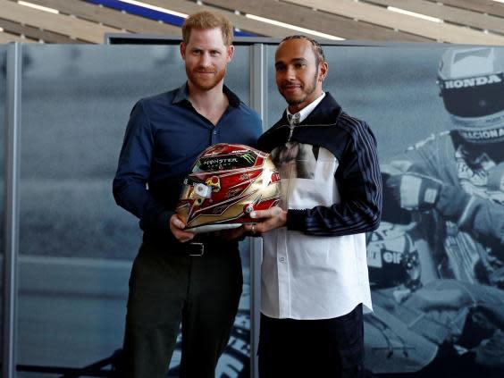 Prince Harry joined Formula 1 driver Lewis Hamilton at the event (Getty)