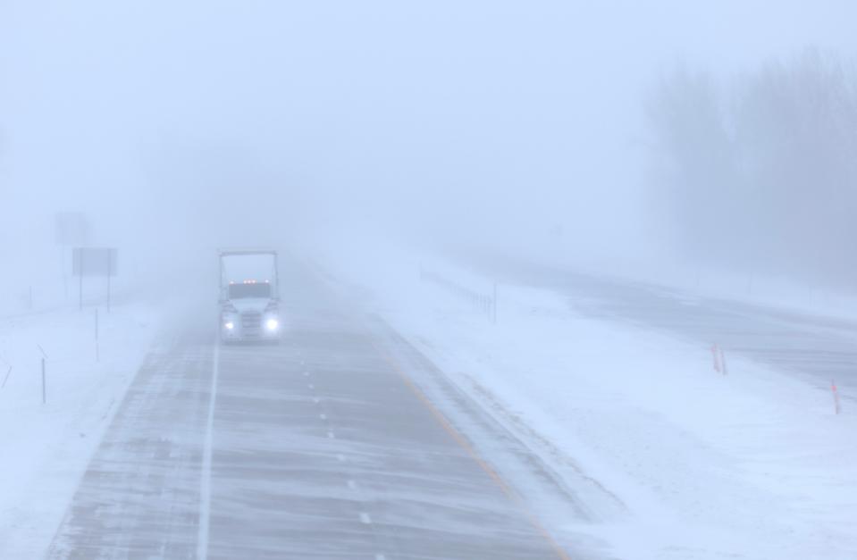 A truck travels on I-35 during blizzard-like conditions on Jan. 13, 2024, in Blencoe, Iowa. The second winter weather system in a week brought blizzard conditions across Iowa as caucusgoers prepare for the Republican presidential caucuses on Jan. 15.