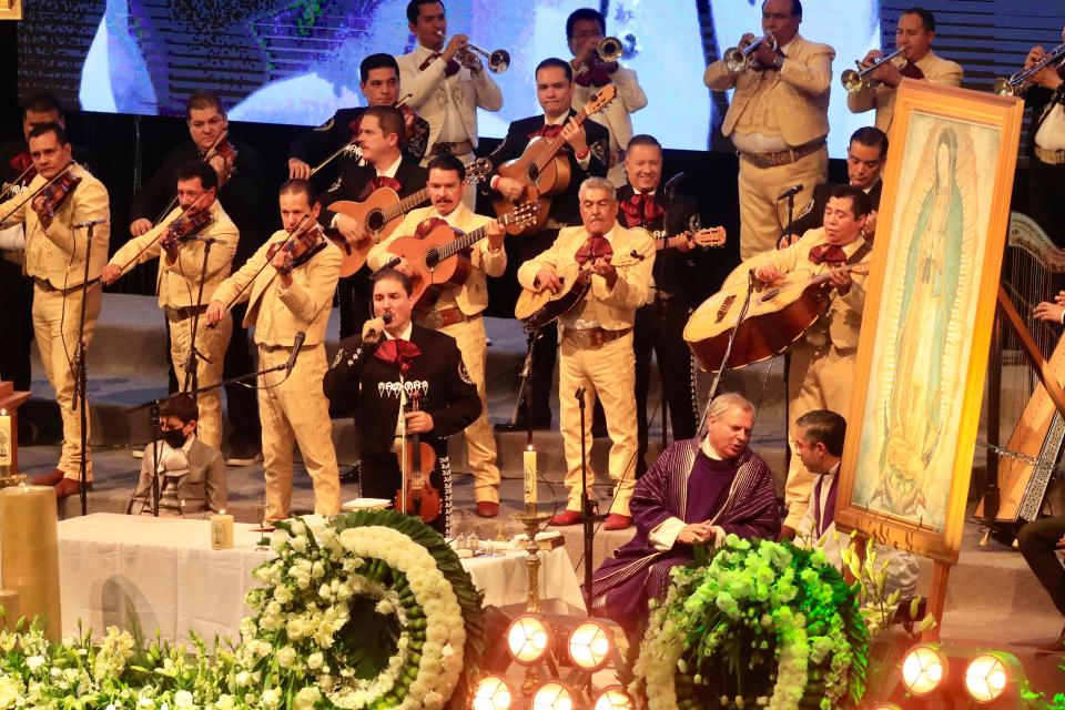 A mariachi group plays during the funeral service of the late Mexican music icon Vicente Fernández in Tlajomulco de Zuñiga, Mexico, Monday, Dec. 13, 2021. Fernández, a beloved Mexican singer who was awarded three Grammys and nine Latin Grammys and inspired a new generation of performers, including his son Alejandro Fernández Jr. has died on Sunday.