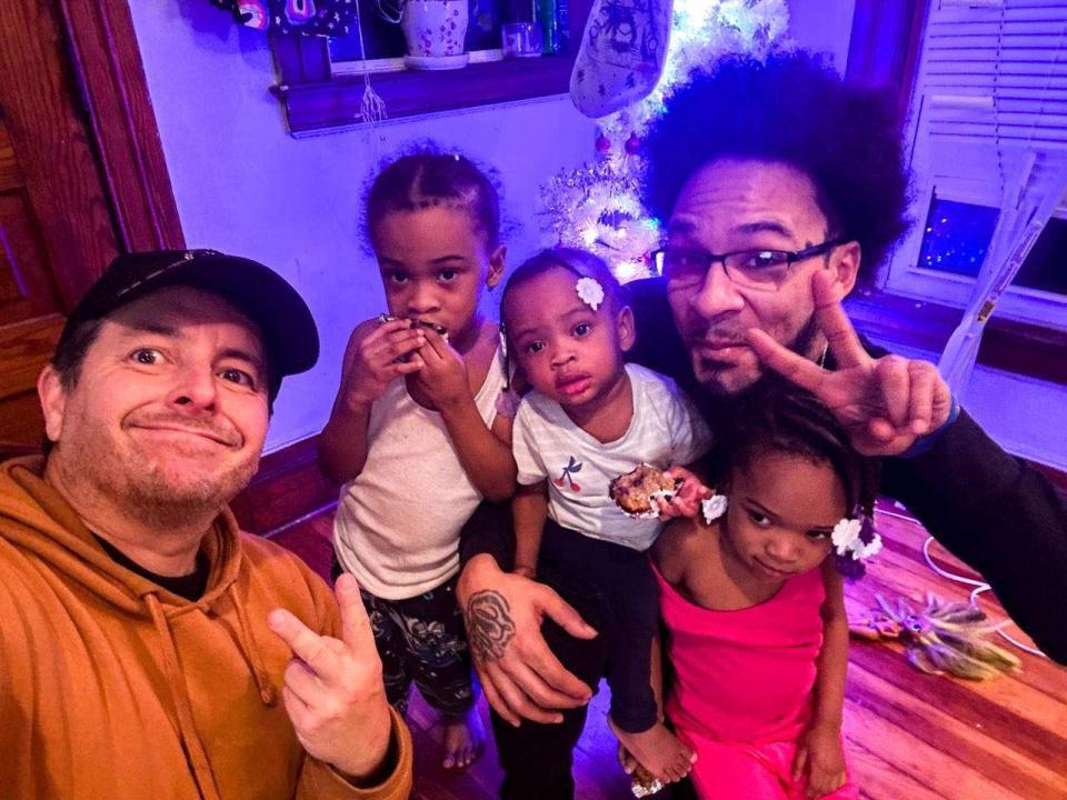 Colin McConnell (left) with Donald Wilson Sr. (right) and his children (left to right) Donald Jr., Honesty and Poetry.