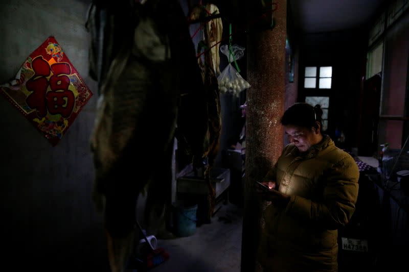 The Wider Image: 'I've let them down': Beijing's migrant workers miss family reunions on Lunar New Year